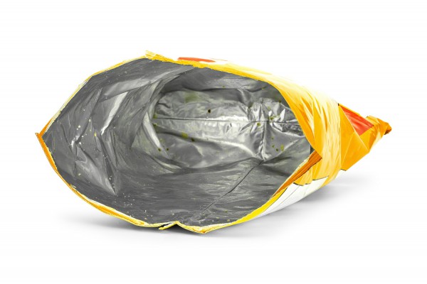 <p>Potato chips bag isolated on white background. Inside of leftovers snack packaging.</p>